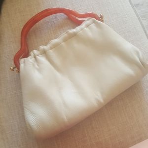 Vintage clutch with bakelite handles.